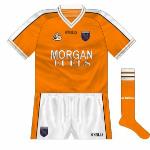 2002:
A subtle change made to the Armagh jerseys for the start of the 2002 championship was that the Morgan Fuels logo was now in white and outlined in black whereas the opposite had been the case. 'Normal' O'Neills numbers returned.