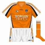 2007:
After three years, Armagh and O'Neills decided on a change of kit, with white sleeves making a return of sorts, the neck now orange rather than white and black more to the fore than it had been.