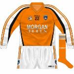 2008:
Long-sleeved version of the 2007 jersey, with the inclusion of a number on the front. The new socks brought in in '07 were unusual in that the stripes were orange-black-orange, whereas those on the shirt and shorts were all orange with black outline. 