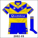 A few slight modifications were made to the Clare jersey for 2002, as white trim was added to the blue parts and the Vodafone name replaced that of Eircell following the multinational company's takeover of the mobile operator.