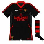2011:
Unusually, the new Down goalkeeper jersey didn't follow the design of the outfield shirt, with a red V-neck used and a slightly different trim on the sides.