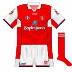 2005:
Louth changed their crest in 2005, and in addition the neck of the collar on the shirt was altered.
