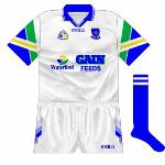 1997:
For 1997, Waterford entered into a nw sponsorship deal with Waterford Co-op. The logo on the front combined the co-op's with that of their Gain Feeds product, while the sleeves now incorporated the same three colours as the Waterford Co-op logo.