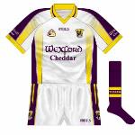 2006: 
When Wexford were drawn with Clare in the 2006 hurling qualifiers, common sense prevailed and the counties tossed for colours, Wexford lining out in white. Oddly, this shirt featured the sponsor's name on the sleeves.